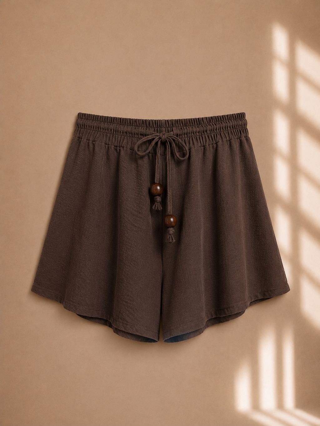 Shorts con coulisse e perline