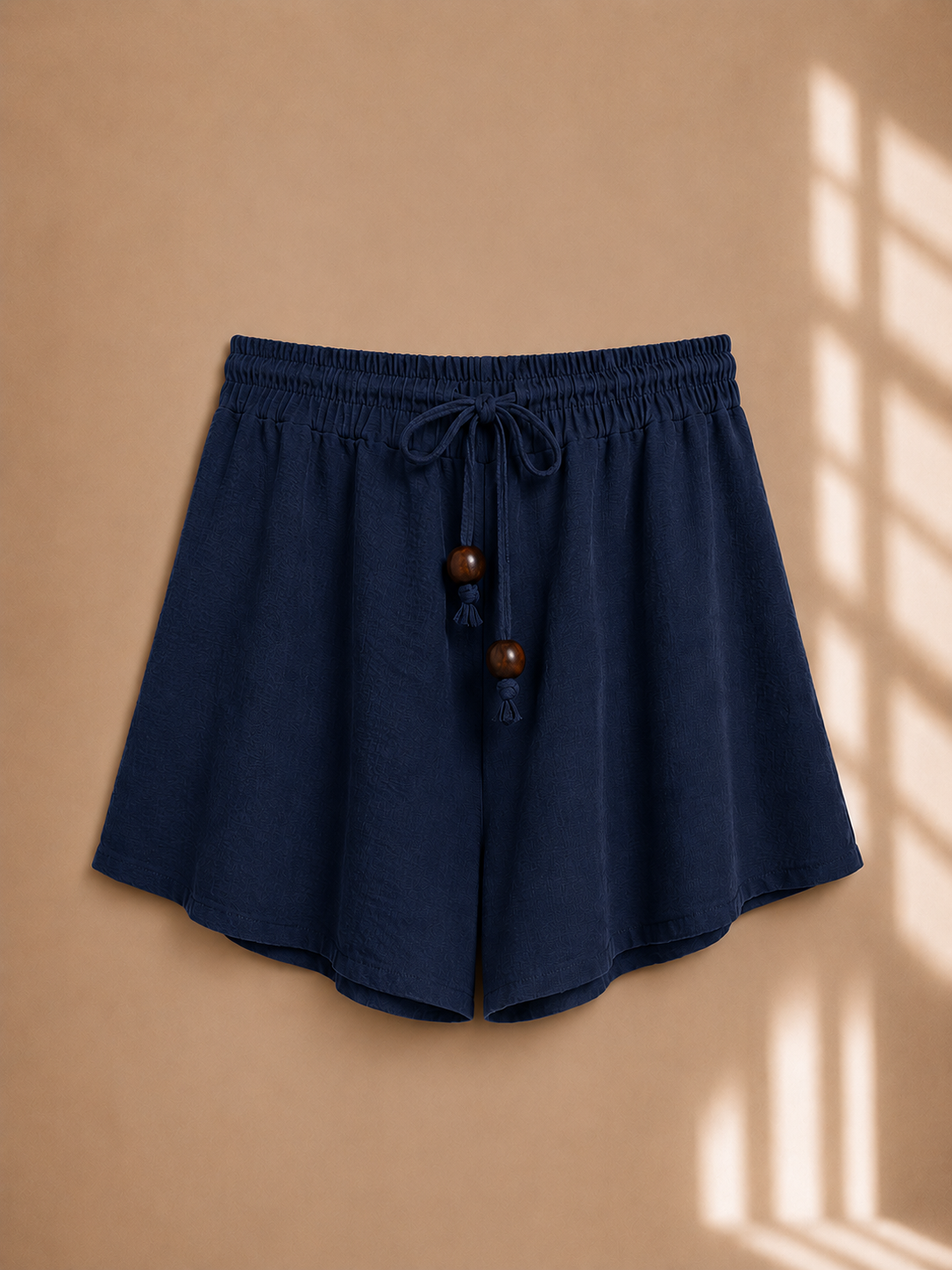 Shorts con coulisse e perline