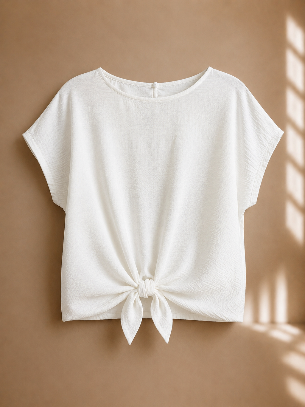 Blusa con nodo frontale